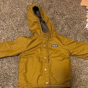 Patagonia Kids' Yellow & Green reversible Hooded Raincoat.